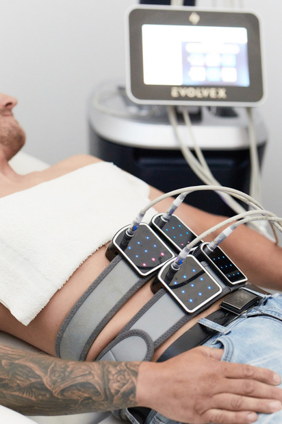 young man getting body contouring treatment