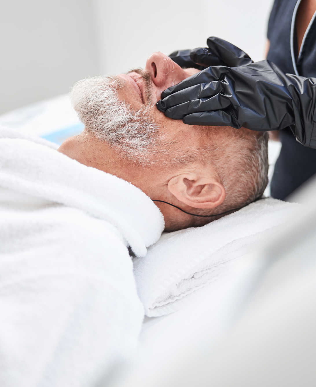 man getting facial treatment